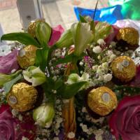 6 Ferrero Rocher  Chocolates  · Add 6 Ferrero Rocher chocolates to your arrangement or bouquet .