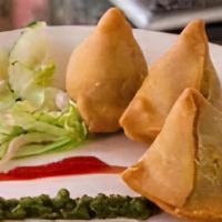Veg Samosa (2) · Homemade turnovers stuffed with a mixture of vegetables and potatoes.