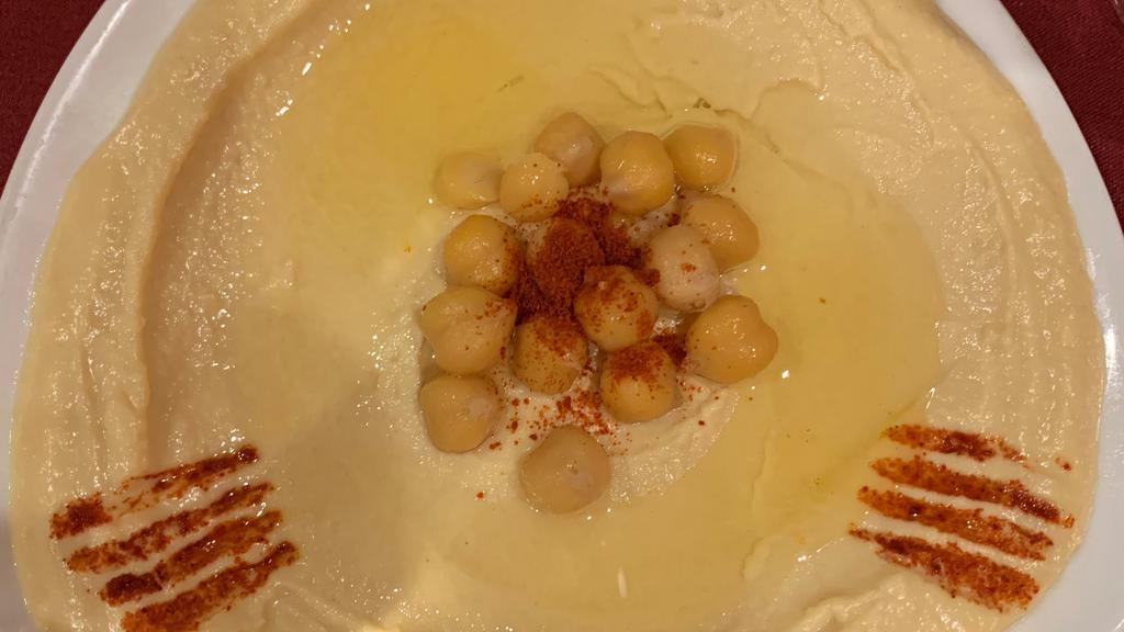 Hummus · A Mediterranean blend of chickpeas, tahini, fresh garlic, lemon juice.