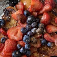 Tsoureki French Toast · Served with berries.