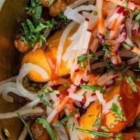 Amritsari Chole Tikki · crispy potato fritters, curried chickpea, green apples, tamarind