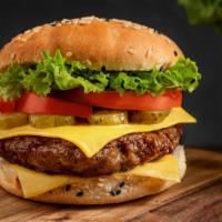 Hamburger · Juicy beef burger with lettuce, tomatoes, pickles, and onions.