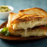 Grilled Four Cheese · Delicious and rich blend of four cheese on a sourdough bread.