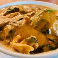 Panang Curry · Medium spicy. With coconut milk, peanut butter, mushroom, egg plant long beans and basil.