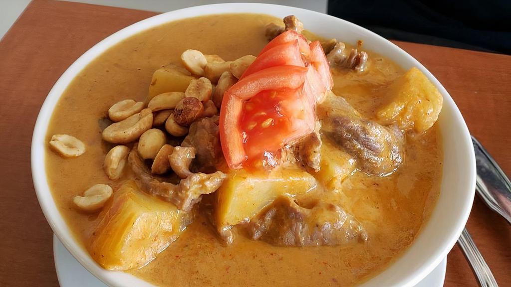 Mussaman Curry · Medium spicy. With coconut milk, potato, tomato, peanuts butter and roasted peanuts.