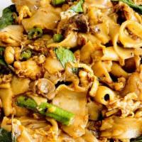 Pad Kee Mao (Drunken Noodle) · Stir-fried chow fun noodles with egg, mushroom, long beans and basil.