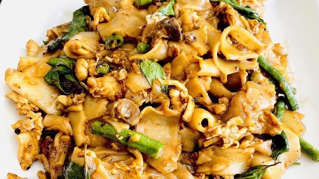 Pad Kee Mao (Drunken Noodle) · Stir-fried chow fun noodles with egg, mushroom, long beans and basil.