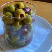 Marinated Olives · Pitted Queen Spanish, Castelvetrano, and Kalamata marinated in Olive Oil, Thyme, Garlic, Pep...
