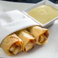Cantonese Spring Rolls · 3 pieces. Shrimp and chicken.