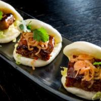 Pork Buns · Charred pork belly, spicy shallots and napa cabbage. Hot.