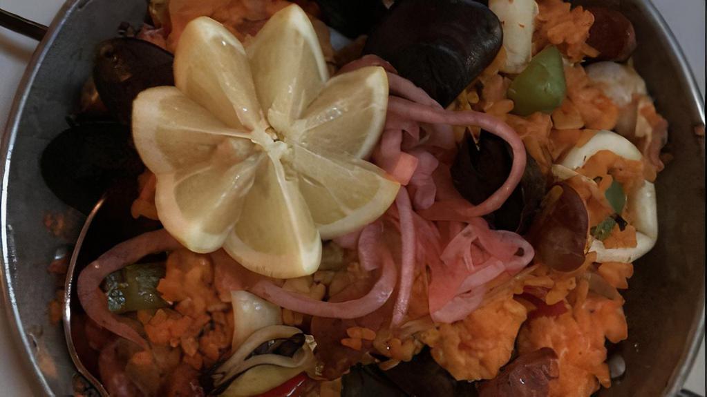 Paella Valenciana Plato · Saffron bomba rice cooked in lobster broth with shrimp, mussels, calamari,  Spanish chorizo sausage and chicken.