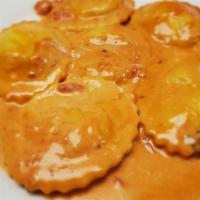 Lobster Ravioli · In a vodka sauce with peas.