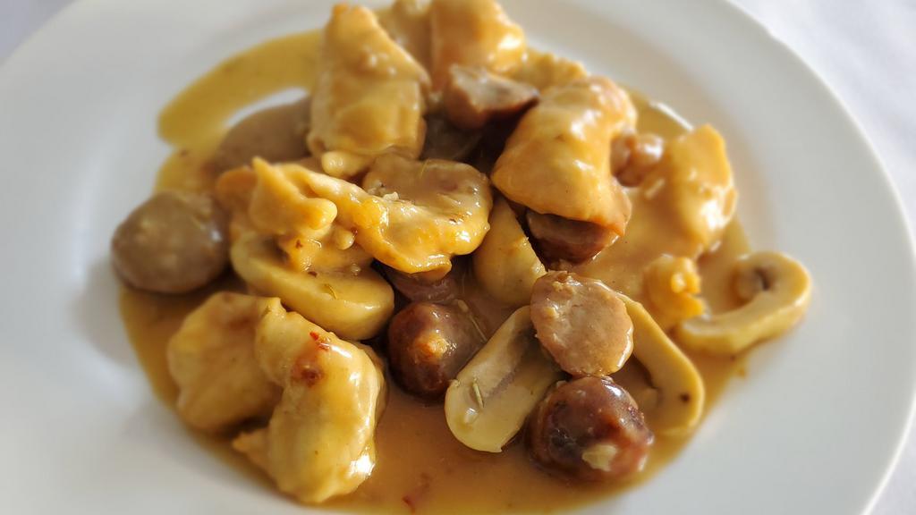Chicken Scarpariello · Breast of chicken sauteed with garlic, sausage, mushrooms, and white wine.