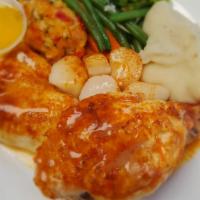 Broiled Seafood Combination · Scallops, flounder, stuffed shrimp, and lobster tail.