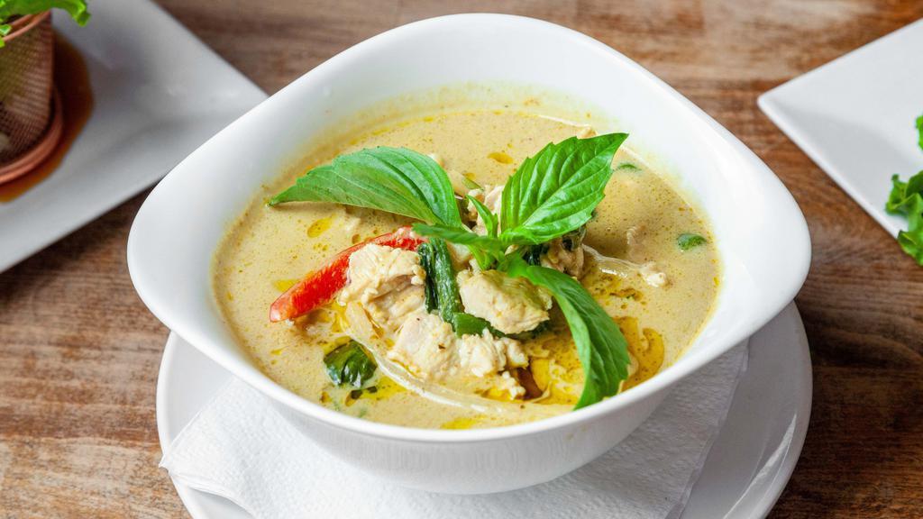 Green Curry · Spicy. Green curry, coconut milk, bell peppers, bamboo shoots, eggplants and basil. Served with jasmine rice.