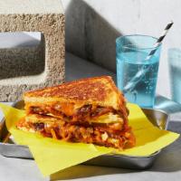 Bbq Chicken Grilled Cheese · Melted cheddar and jack cheese, chicken, caramelized onions, and BBQ sauce between two slice...