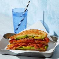 Bacon Avocado Grilled Cheese · Melted cheddar, bacon, and avocado between two slices of buttery grilled bread.