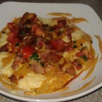 Grid’S Shrimp And Grits · Pan seared shrimp simmered in Grid’s chipotle garlic Cream sauce topped with applewood smoke...