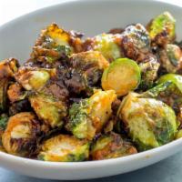 Spicy Sprouts · Oven roasted brussels sprouts, grade a maple syrup, and red chili sauce.