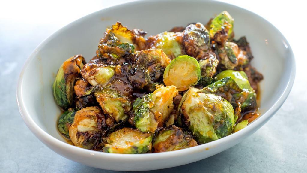 Spicy Sprouts · Oven roasted brussels sprouts, grade a maple syrup, and red chili sauce.