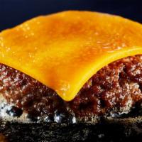 Beef Patty With Melted Cheese · A perfectly cooked beef patty.