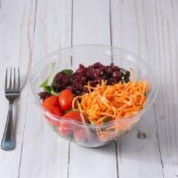 House Salad · Served with mixed greens, carrots, tomatoes, cucumbers, cranberries, and red onions.