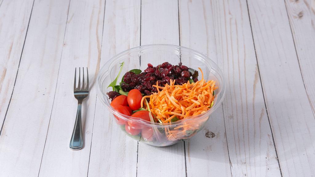House Salad · Served with mixed greens, carrots, tomatoes, cucumbers, cranberries, and red onions.