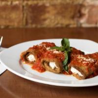 Eggplant Rollatini · Breaded eggplant rolled with seasoned ricotta cheese, with tomato sauce.