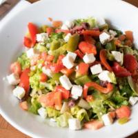 Chopped Salad · Romaine lettuce, roasted peppers, chickpeas, diced tomatoes, Kalamata olives, feta cheese, b...