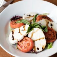 Caprese Salad · Fresh mozzarella cheese, tomatoes, basil, olive oil, balsamic reduction.