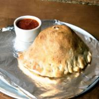 Spinach Pie Calzone · Calzone filled with mozzarella cheese, spinach, pepperoni and roasted garlic.
