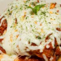 Lasagna · Fresh pasta, baked with layers of meat sauce, mozzarella & ricotta cheese.