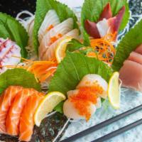 Sashimi Deluxe · Twenty pieces of assorted sashimi and rice. Served with clear or miso soup and salad.