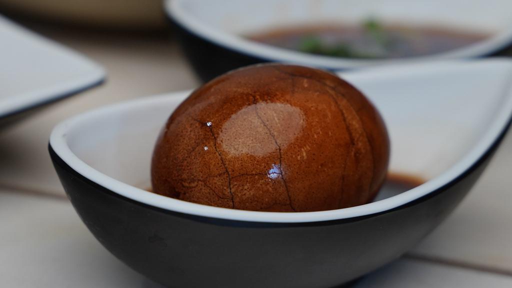 Tea Egg 茶叶蛋 · Egg boiled with black tea, soy source and  secret spices from Taiwanese Mom.