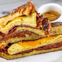 French Toast Bacon Egg & Cheese · Scrambled eggs, turkey bacon, cheddar, served between french toast, with maple butter. *Only...