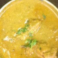 Chicken Curry · Tender pieces of boneless chicken, cooked in home style curry sauce. Served with basmati rice.