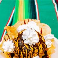 Fried Ice Cream · Vanilla ice cream coated with corn cereal, in a flour shell topped with chocolate sauce and ...