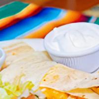 Don Patron Quesadilla · Flour tortilla, with cheese, choice of shredded chicken, shredded beef or ground beef, garni...