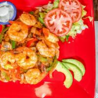 Camaron Arroz · Shrimp sautéed with bell pepper, onions, mushrooms, and red mild sauce, served in a bed of s...