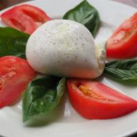 Burrata Mozzarella Pomodoro · Cream filled mozzarella. Garden tomatoes, fresh basil.