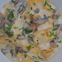Fresh Handmade Pappardelle · Wild mushrooms and creamy truffle oil.