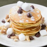 Chocolate Chip Pancakes · Fluffy chocolate chip pancakes served with a side of butter and syrup.