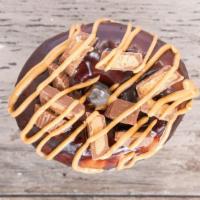 Pb Delight · Chocolate glaze with peanut butter cup pieces and a PB drizzle.