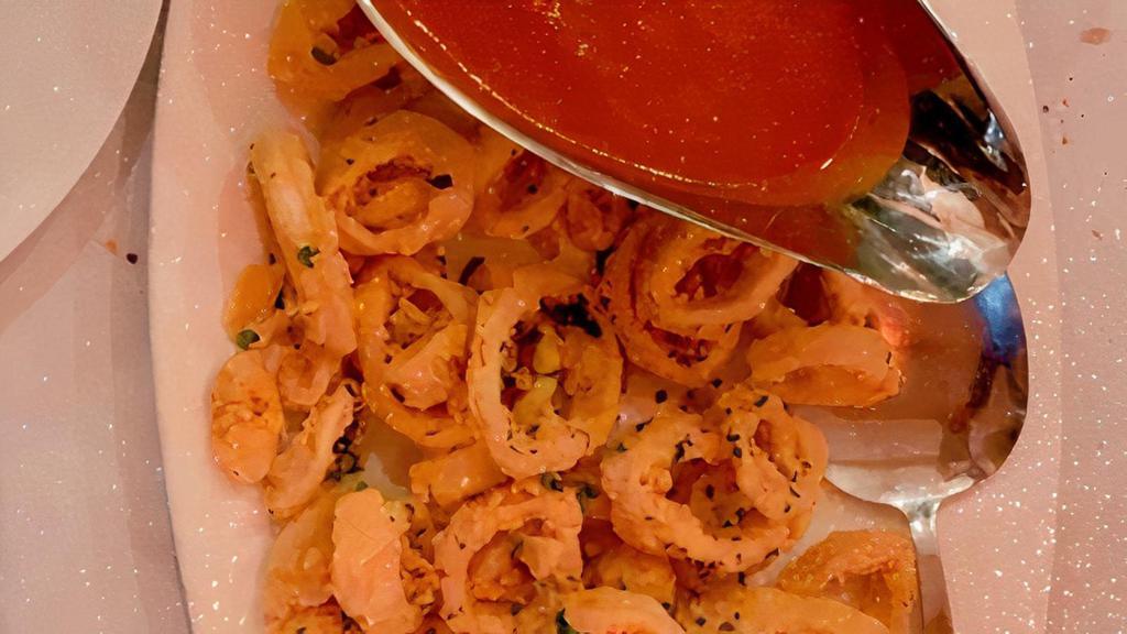 Calamari Fritti · Fried calamari, tomato sauce and lemon.