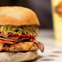 Cordon Bleu Burger · Boneless chicken breast, smoked ham, Swiss cheese, lettuce, tomato, red onions, and honey mu...