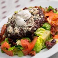 Black And Bleu Salad · Blackened Angus beef, crisp iceberg wedge, tomatoes, bleu cheese crumbles, smoked bacon, fre...