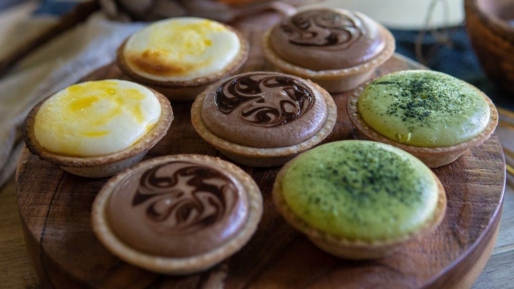 Six Tarts · Choose any 6 tarts.
Flavors available: 
-Original Cheese
-Ube
-Black Sesame
-Matcha
-Chocolate
-Original Cheese with Blueberry Filling.