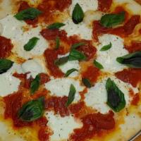 Margherita Pizza · Sliced Tomatoes, Fresh Basil, Garlic, Oregano, Mozzarella & Romano.
