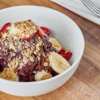 Nutella Açaí Bowl · Organic acai, blueberry, apple juice, banana, dates topped with nutella, banana, strawberry ...