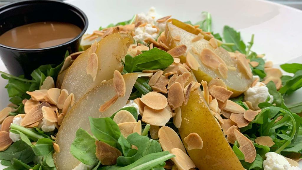 Pear Salad · Baby arugula, pears, almonds, goat cheese.